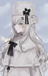  1girl black_bow blue_eyes blush bow capelet chiemo_(xcem) closed_mouth coat expressionless from_side fur_hat hair_bow hair_bun hat hat_bow long_hair looking_at_viewer looking_to_the_side original outdoors pom_pom_(clothes) silver_hair solo ushanka white_capelet white_coat white_headwear 