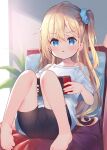  1girl bangs bare_shoulders barefoot black_shorts blonde_hair blue_eyes blush collarbone commentary eyebrows_visible_through_hair hair_between_eyes highres holding knees_up long_hair looking_at_viewer meito_(maze) nintendo_switch off_shoulder one_side_up original parted_lips pillow shirt short_shorts short_sleeves shorts solo very_long_hair white_shirt 