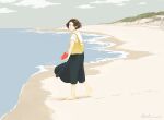  1girl bag barefoot beach black_skirt brown_hair clouds footwear_removed holding holding_shoes looking_at_viewer original otonai_chiaki red_footwear shirt shoes short_hair short_sleeves shoulder_bag skirt smile solo standing water white_shirt wide_shot yellow_bag 