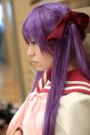  cosplay hair_ribbons hiiragi_kagami lucky_star naito photo purple_hair sailor_uniform school_uniform socks twintails 