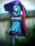  1girl absurdres bangs blue_eyes blue_hair blue_skirt blue_vest blurry depth_of_field english_commentary geta heterochromia highres holding holding_umbrella karakasa_obake looking_at_viewer no_socks outdoors puffy_sleeves purple_umbrella red_eyes renzibun shirt short_hair short_sleeves skirt solo tatara_kogasa tongue tongue_out touhou umbrella vest white_shirt 