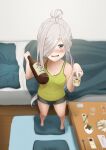  1girl ahoge alternate_costume asashimo_(kancolle) barefoot bed beer_can black_shorts bottle can casual commentary_request cushion dolphin_shorts drunk foreshortening full_body green_tank_top grey_eyes jewelry kantai_collection long_hair looking_at_viewer pillow ring saga_(saga_kancolle) sake_bottle shorts silver_hair solo standing table tank_top wedding_band zabuton 