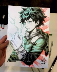  1boy art_tools_in_frame artist's_hand_in_frame aura boku_no_hero_academia closed_mouth commentary cropped_torso english_commentary freckles gloves green_hair green_hoodie highres hood hoodie male_focus marker_(medium) mask midoriya_izuku photo_(medium) short_hair signature solo spiky_hair stanley_lau traditional_media unworn_mask white_gloves 