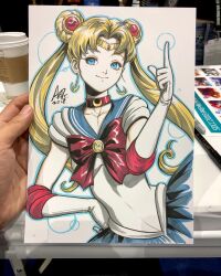  1girl art_tools_in_frame artist's_hand_in_frame bishoujo_senshi_sailor_moon blonde_hair blue_eyes blue_outline blue_sailor_collar choker closed_mouth collarbone commentary crescent crescent_choker crescent_earrings double_bun earrings elbow_gloves english_commentary gloves hair_bun highres jewelry long_hair magical_girl marker_(medium) outline photo_(medium) red_choker sailor_collar sailor_moon sailor_senshi_uniform shirt signature smile solo stanley_lau traditional_media tsukino_usagi twintails upper_body white_background white_gloves white_shirt 