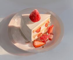  absurdres cake cake_slice commentary cream cross-section english_commentary food food_focus fruit highres jpeg_artifacts no_humans original photo-referenced plate still_life strawberry strawberry_shortcake tako_yuui 