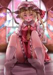  1girl :o absurdres bad_feet bangs blurry blurry_background blush breasts commentary_request crystal eyebrows_visible_through_hair flandre_scarlet frilled_shirt_collar frills glint hair_between_eyes hat hat_ribbon highres indoors knees_up looking_at_viewer maboroshi_mochi medium_breasts mob_cap necktie no_shoes on_bed one_side_up open_mouth orange_eyes petticoat puffy_short_sleeves puffy_sleeves red_ribbon red_skirt red_vest ribbon short_hair short_sleeves sitting skirt skirt_set socks soles solo touhou vest wall white_headwear white_legwear window wings yellow_neckwear 