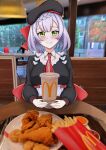  1girl absurdres blush braid cup drinking_straw employee_uniform fast_food fast_food_uniform food french_fries fried_chicken genshin_impact green_eyes highres kfc looking_at_viewer mcdonald&#039;s noelle_(genshin_impact) plate smile solo table uniform white_hair 