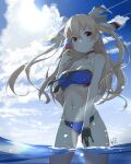  1girl beach bikini black_gloves blue_swimsuit breasts brown_eyes choker clouds cloudy_sky day eyebrows_visible_through_hair gloves hair_between_eyes hair_ribbon ice_cream_cone johnston_(kancolle) kantai_collection light_brown_hair long_hair looking_at_viewer medium_breasts navel neve ocean partially_submerged ribbon signature single_glove sky solo standing sun swimsuit two_side_up water 