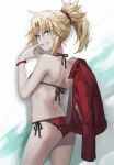  1girl ass back bangs bare_shoulders bikini blonde_hair braid breasts commentary fate/grand_order fate_(series) french_braid green_eyes grin hair_ornament hair_scrunchie halterneck highres jacket jacket_removed jewelry long_hair looking_at_viewer looking_back mordred_(fate)_(all) mordred_(swimsuit_rider)_(fate) necklace ponytail red_bikini red_jacket red_scrunchie scrunchie side-tie_bikini sidelocks simple_background small_breasts smile solo string_bikini swimsuit tail thighs tonee 