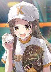  1girl absurdres ball baseball baseball_(object) baseball_cap baseball_mitt baseball_uniform blurry blurry_background blush brown_eyes brown_hair clothes_writing commentary_request gakuen_idolmaster hat highres holding holding_ball idolmaster kuramoto_china long_hair looking_at_viewer outdoors shima46 shirt short_sleeves smile solo sportswear teeth upper_body upper_teeth_only white_shirt 