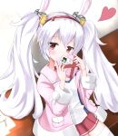  1girl akura_scarlet0495 animal_ears azur_lane bangs brown_eyes candy chocolate chocolate_heart commentary_request covering_mouth eyebrows_visible_through_hair eyes_visible_through_hair fake_animal_ears food hairband head_tilt heart highres holding jacket laffey_(azur_lane) long_hair long_sleeves looking_at_viewer pleated_skirt rabbit_ears red_skirt sidelocks skirt solo thigh-highs translation_request twintails white_hair zettai_ryouiki 