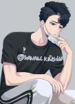  1boy bangs black_eyes black_hair grey_background haikyuu!! kakan_king looking_away male_focus mask mask_pull mouth_mask parted_lips sakusa_kiyoomi shirt short_hair simple_background sitting solo t-shirt twitter_username 