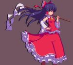  1girl ascot bangs black_hair bow brown_background closed_mouth cowboy_shot detached_sleeves frilled_skirt frills gohei hair_bow hair_tubes hakurei_reimu hand_on_hip holding long_hair looking_at_viewer nontraditional_miko potemki11 red_bow red_eyes red_shirt red_skirt ribbon-trimmed_sleeves ribbon_trim shirt simple_background skirt solo standing touhou wide_sleeves yellow_neckwear 