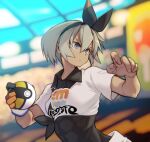  10mo 1girl abs bea_(pokemon) dark_skin dark-skinned_female gloves grey_eyes grey_hair hairband highres holding holding_poke_ball poke_ball pokemon pokemon_(game) pokemon_swsh single_glove ultra_ball 