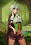  1girl bangs belt belt_buckle black_belt blush bow breasts brown_shorts buckle cape cowboy_shot deilan12 elf english_commentary forest goblin_slayer! green_eyes green_hair high_elf_archer_(goblin_slayer!) highres long_hair looking_at_viewer nature no_panties open_clothes open_shorts outdoors pointy_ears short_shorts shorts sidelocks small_breasts smile solo tree watermark web_address 