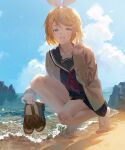  1girl bangs bare_legs barefoot beach black_skirt blonde_hair blue_eyes blue_sailor_collar blue_shirt brown_cardigan brown_hair cardigan clouds copyright_request day eyebrows_visible_through_hair fajyobore full_body grin hand_up highres holding holding_shoes loafers long_sleeves looking_at_viewer neckerchief ocean red_neckwear sailor_collar school_uniform serafuku shirt shoes shoes_removed short_hair skirt sky smile solo squatting v 