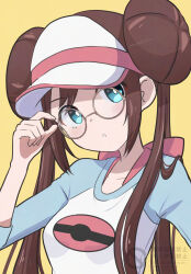  1girl adjusting_eyewear aoneko4ao_(edwf7745) blue_eyes blue_shirt brown_hair commentary_request donut_hair_bun double_bun glasses hair_bun highres looking_at_viewer open_mouth poke_ball poke_ball_print pokemon pokemon_black_2_and_white_2 raglan_sleeves rosa_(pokemon) round_eyewear shirt shorts sidelocks solo strap twintails upper_body visor_cap white_shirt yellow_background yellow_shorts 