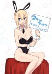  1girl :d absurdres animal_ears black_leotard blonde_hair blue_eyes blush breasts fake_animal_ears feet_out_of_frame flying_sweatdrops hair_bun highleg highleg_leotard highres holding holding_sign kinpatsu-chan_(rucchiifu) large_breasts legs_together leotard looking_at_viewer open_mouth original playboy_bunny rabbit_ears rucchiifu sign sitting smile solo translation_request wrist_cuffs 