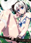  1girl bangs bare_shoulders bikini black_bow black_hairband blue_bikini blue_eyes blush bow collarbone colored_eyelashes commentary_request cute day eyebrows_visible_through_hair grass hair_between_eyes hair_ribbon hairband highres hitodama katana knees_up konpaku_youmu konpaku_youmu_(ghost) navel open_mouth outdoors polka_dot polka_dot_bikini ribbon sazanami_mio scabbard sheath sheathed short_hair silver_hair sitting solo strap_slip swimsuit sword touhou weapon white_bikini 