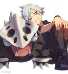  1boy bangs black_pants closed_mouth commentary_request gen_3_pokemon grey_eyes grey_hair highres lairon light_blush looking_at_viewer male_focus pants pokemon pokemon_(creature) pokemon_(game) pokemon_rse purple_footwear shirt shoes short_hair short_sleeves sitting smile spiky_hair steven_stone twitter_username white_background xia_(ryugo) younger 