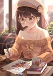  1girl bare_shoulders book brown_hair cafe collarbone drawing eating eraser glasses hat headphones indoors mug original pen ribbon sitting sweat wizard wizard_hat yellow_eyes 