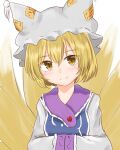  1girl animal_ears blonde_hair breasts dakuazu dress fox_ears fox_tail hat highres light_blush looking_at_viewer medium_breasts multiple_tails pillow_hat short_hair simple_background smile solo tabard tail touhou upper_body white_background white_dress yakumo_ran yellow_eyes 