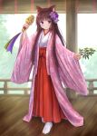  1girl animal_ear_fluff animal_ears bangs bell blue_eyes blunt_bangs blush brown_hair cat_ears closed_mouth commentary_request eyebrows_visible_through_hair flower full_body hair_flower hair_ornament hakama highres holding iroha_(iroha_matsurika) japanese_clothes jingle_bell kagura_suzu kimono long_hair long_sleeves looking_at_viewer miko mutsuki_(iroha_(iroha_matsurika)) open_clothes original purple_flower railing red_hakama smile socks solo standing tabi very_long_hair white_kimono white_legwear wide_sleeves 