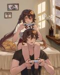  1boy 1girl :p absurdres bed bed_sheet bedroom between_legs black_shirt blush brown_hair candle carrying carrying_over_shoulder casual cat controller flower flower_pot genshin_impact girl_on_top highres holding holding_controller hu_tao_(genshin_impact) indoors licking_lips lilithmy picture_frame playing_games ponytail red_eyes red_shorts shirt short_sleeves shorts sitting sitting_on_person sweatdrop symbol-shaped_pupils tongue tongue_out twintails white_shirt yellow_eyes zhongli_(genshin_impact) 