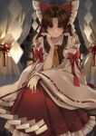  1girl ascot bare_shoulders bow brown_eyes brown_hair detached_sleeves frills hair_bow hair_tubes hakurei_reimu hand_on_own_cheek hand_on_own_face highres long_hair looking_at_viewer meji_aniki red_skirt red_vest skirt solo touhou vest 