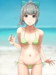  1girl artist_name ass_visible_through_thighs bangs beach bikini blue_sky blunt_bangs blurry bow breasts brown_eyes collarbone commentary_request cowboy_shot day depth_of_field green_bikini green_bow grey_hair groin hair_bow highres horizon kantai_collection long_hair looking_at_viewer navel ocean outdoors side-tie_bikini sky small_breasts smile solo standing striped striped_bikini swimsuit twitter_username yuubari_(kancolle) yuushou 