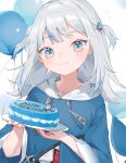  1girl absurdres balloon bangs blue_eyes blue_hair blush cake fish_tail food gawr_gura hair_ornament happy_birthday highres hololive hololive_english hood hoodie looking_at_viewer mokyuko multicolored_hair open_mouth shark_tail silver_hair solo streaked_hair tail virtual_youtuber 