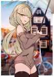  1girl :d absurdres bag black_legwear blurry blurry_background blush bottle braid breasts brown_sleeves brown_sweater choumi_wuti_(xueye_fanmang_zhong) commentary_request day depth_of_field detached_sleeves fang girls_frontline green_eyes green_hair hair_ornament hair_over_one_eye hairclip highres holding holding_umbrella long_hair long_sleeves looking_at_viewer medium_breasts open_mouth plastic_bag sleeveless_sweater smile solo sweater tac-50_(girls_frontline) thigh-highs transparent transparent_umbrella umbrella very_long_hair 