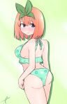  1girl ass bangs bare_arms bare_shoulders bikini blue_eyes blush breasts closed_mouth commentary_request eyebrows_behind_hair floral_print frilled_bikini frills go-toubun_no_hanayome green_background green_bikini green_ribbon hair_between_eyes hair_ribbon highres kujou_karasuma looking_at_viewer looking_back medium_breasts nakano_yotsuba print_bikini ribbon sideboob signature solo sweat swimsuit wavy_mouth 