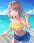  1girl :d anbe_yoshirou bangs bare_arms bare_shoulders bikini bikini_day blush brown_hair closed_eyes collarbone commentary_request cowboy_shot day denim denim_shorts eyebrows_visible_through_hair facing_viewer highres layered_bikini leaning_forward medium_hair navel ocean open_mouth original outdoors short_shorts shorts smile solo stomach swimsuit water yellow_bikini 