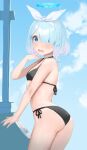  1girl arona_(blue_archive) ass black_swimsuit blue_archive blue_eyes blue_hair blush breasts clouds commentary_request hair_over_one_eye halo headband highres looking_at_viewer nekoshoko open_mouth short_hair sky small_breasts solo swimsuit 