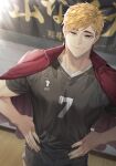  1boy bangs black_pants blonde_hair brown_eyes eyebrows haikyuu!! hands_on_hips hemoon indoors jacket jacket_on_shoulders looking_at_viewer male_focus miya_atsumu multicolored_hair pants short_hair shorts smile solo sportswear standing track_jacket two-tone_hair volleyball_uniform 