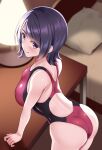  1girl ass bangs bed blush commentary_request competition_swimsuit desk eyebrows_visible_through_hair huyumitsu indoors leaning_forward one-piece_swimsuit original pillow purple_hair short_hair smile solo swept_bangs swimsuit two-tone_swimsuit violet_eyes 