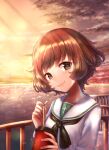  1girl akiyama_yukari bangs black_neckwear blouse brown_eyes brown_hair closed_mouth clouds cloudy_sky commentary_request cup disposable_cup drinking_straw eyebrows_visible_through_hair girls_und_panzer head_tilt holding holding_cup horizon long_sleeves looking_at_viewer messy_hair neckerchief ocean ooarai_school_uniform orange_sky outdoors partial_commentary railing sailor_collar school_uniform short_hair sky smile solo sparkle standing twilight white_blouse white_sailor_collar yu_sakurai06 