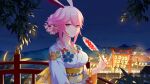  1065587906 1girl animal_ears bangs bridge closed_mouth fan fireworks floral_print flower hair_bun hair_flower hair_ornament highres holding holding_fan honkai_(series) honkai_impact_3rd japanese_clothes kimono lantern looking_at_viewer night night_sky obi outdoors paper_fan pink_hair rabbit_ears sash sidelocks sky smile solo torii tree uchiwa violet_eyes yae_sakura 