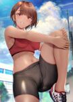  1girl bike_shorts blush bra breasts clouds dark_skin eyebrows_visible_through_hair gentsuki highres long_hair looking_at_viewer medium_breasts midriff monochrome navel original outdoors parted_lips red_bra shoes short_hair sky smile sneakers solo sports_bra standing standing_on_one_leg sweat underwear 