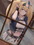  1girl befu blonde_hair blue_eyes blue_shirt blurry breasts cowboy_shot cropped_jacket depth_of_field dutch_angle gambier_bay_(kancolle) hairband highres kantai_collection large_breasts long_hair looking_at_viewer midriff number pleated_skirt remodel_(kantai_collection) shirt skirt solo twintails window 