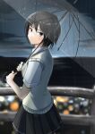  1girl amagami bangs black_hair blurry blurry_background brown_eyes city closed_mouth clouds cloudy_sky commentary cowboy_shot dress_shirt expressionless from_side highres holding holding_umbrella kibito_high_school_uniform looking_at_viewer looking_back nanasaki_ai night ocean railing rain school_uniform shirt short_hair short_sleeves sky solo transparent transparent_umbrella umbrella walking white_shirt yellow_sweater_vest ykh1028 