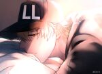  1boy baseball_cap blonde_hair bou_(maimoca501) close-up eyebrows_visible_through_hair face from_side half-closed_eyes hat hataraku_saibou highres killer_t_(hataraku_saibou) looking_at_viewer lying male_focus military military_uniform on_bed on_stomach short_hair short_sleeves solo sunlight uniform 