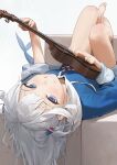  1girl barefoot blue_eyes blue_jacket fish_tail gawr_gura guitar hair_ornament highres holding holding_instrument hololive instrument jacket legs long_hair looking_at_viewer lying mossi on_back shark_tail sharp_teeth smile solo tail teeth toenails toes virtual_youtuber white_hair 