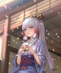  1girl :d aqua_eyes architecture bangs blunt_bangs blurry bow cherry_blossom_print commentary_request cup damon_ct depth_of_field east_asian_architecture eyebrows_visible_through_hair floral_print genshin_impact hair_bow hair_ornament hair_ribbon highres holding holding_cup japanese_clothes kamisato_ayaka kimono long_hair long_sleeves looking_away mole mole_under_eye obi open_mouth petals ribbon sash sidelocks signature silver_hair smile solo tress_ribbon wide_sleeves wind yunomi 