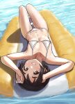  1girl absurdres alternate_costume bangs bare_arms bare_legs bare_shoulders barefoot bikini black_hair blush brown_eyes commentary_request day flat_chest from_above grin highres inflatable_raft kantai_collection kibitarou looking_at_viewer lying maru-yu_(kancolle) micro_bikini navel on_back outdoors short_hair smile solo swimsuit upside-down water wet white_bikini 