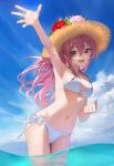  1girl arched_back arm_up bangs bare_shoulders bikini blue_sky breasts clouds commentary day eyebrows_visible_through_hair floating_hair flower foreshortening hair_between_eyes hair_intakes hat hat_flower hibiscus highres idolmaster idolmaster_cinderella_girls jougasaki_mika leaning_forward legs_together long_hair looking_at_viewer medium_breasts navel open_mouth outdoors pink_flower pink_hair red_flower side-tie_bikini sky smile solo standing straw_hat suketoudara_(artist) swimsuit wading water white_bikini 