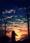 1girl absurdres bird building city clouds flock highres long_hair original reflection scenery silhouette skyrick9413 solo standing sun sunset water water_surface wind_turbine 