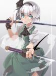  1girl ascot black_neckwear brown_gloves closed_mouth dual_wielding gloves green_eyes green_skirt green_vest grey_background grey_hair hairband highres holding holding_sword holding_weapon katana konpaku_youmu looking_at_viewer partially_fingerless_gloves puffy_short_sleeves puffy_sleeves reiga_(act000) shirt short_hair short_sleeves skirt solo sword touhou vest weapon white_shirt 