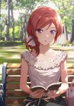  1girl alternate_costume bag bangs bench blouse book day eyebrows_visible_through_hair frills grass hair_ornament hair_scrunchie handbag holding holding_book looking_at_viewer love_live! love_live!_school_idol_project medium_hair nishikino_maki open_mouth outdoors reading redhead scrunchie shamakho shirt side_ponytail sitting sleeveless sleeveless_shirt solo tree upper_body violet_eyes white_blouse 